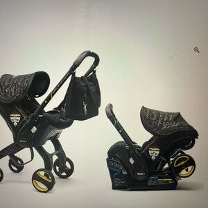 Doona Infant Car Seat & Stroller in Black with Yellow Accents